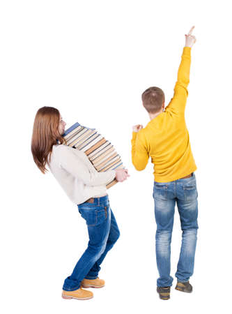 Back view of couple in sweater pointing. Rear view people collection. backside view of person. Isolated over white background.の写真素材