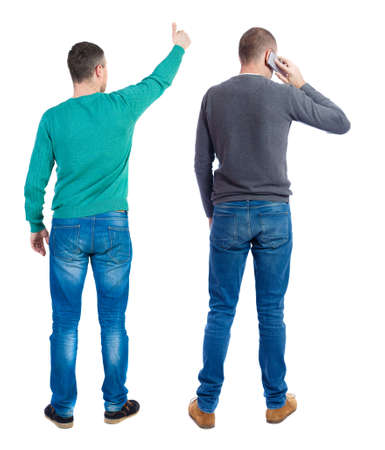 Back view of two man in sweater with mobile phone. Rear view people collection. backside view of person. Isolated over white background.の写真素材