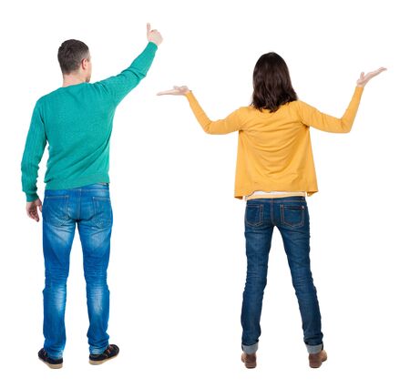 Back view of couple in sweater showing thumbs up. beautiful woman and man together. Rear view people collection. backside view of person. Isolated over white background.の写真素材