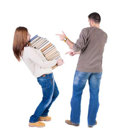 Back view of couple in sweater pointing. Rear view people collection. backside view of person. Isolated over white background.の写真素材