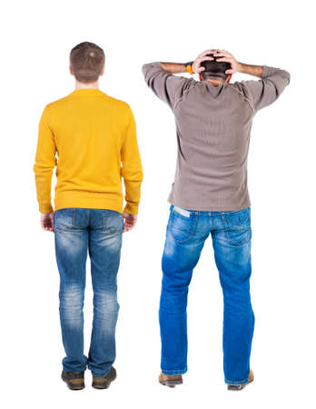 Back view of two man in sweater pointing. Rear view people collection. backside view of person. Isolated over white background.の写真素材