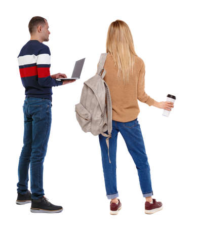 Back view couple with laptop in sweater. beautiful man and woman. Rear view people collection. backside view of person. Isolated over white background.の写真素材
