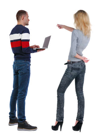 Back view couple with laptop in sweater. beautiful man and woman. Rear view people collection. backside view of person. Isolated over white background.の写真素材