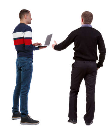 Back view two man in sweater with laptop. Rear view people collection. backside view of person. Isolated over white background. Guys looking forwardの写真素材