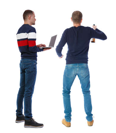Back view two man in sweater with laptop. Rear view people collection. backside view of person. Isolated over white background. Guys looking forwardの写真素材