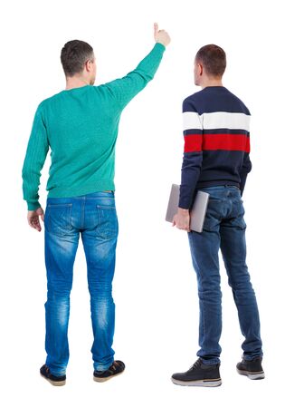 Back view two man in sweater with laptop. Rear view people collection. backside view of person. Isolated over white background. Guys looking forwardの写真素材