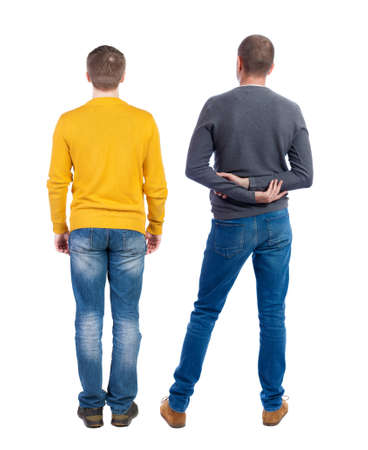 Back view of two man in sweater pointing. Rear view people collection. backside view of person. Isolated over white background.の写真素材