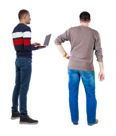Back view two man in sweater with laptop. Rear view people collection. backside view of person. Isolated over white background. Guys looking forwardの写真素材