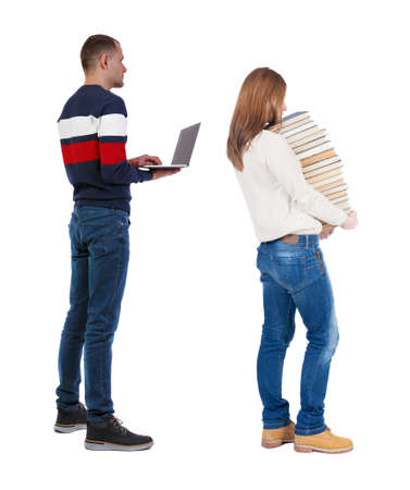 Back view couple with laptop in sweater. beautiful man and woman. Rear view people collection. backside view of person. Isolated over white background.の写真素材