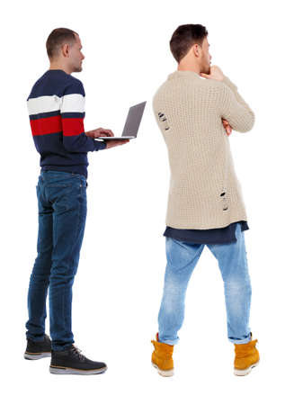 Back view two man in sweater with laptop. Rear view people collection. backside view of person. Isolated over white background. Guys looking forwardの写真素材