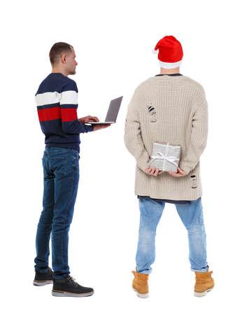 Back view two man in sweater with laptop. Rear view people collection. backside view of person. Isolated over white background. Guys looking forwardの写真素材