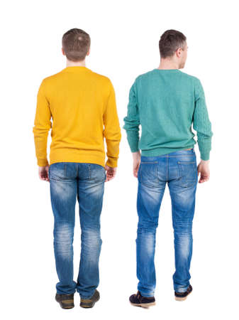 Back view of two man in sweater pointing. Rear view people collection. backside view of person. Isolated over white background.の写真素材