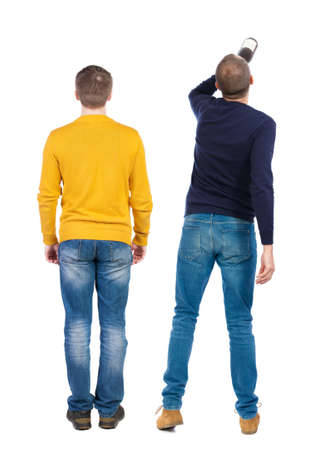 Back view of two man in sweater pointing. Rear view people collection. backside view of person. Isolated over white background.の写真素材
