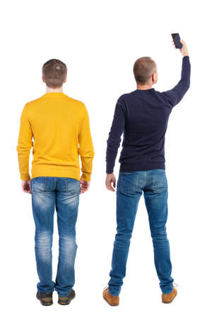 Back view of two man in sweater with mobile phone. Rear view people collection. backside view of person. Isolated over white background.の写真素材