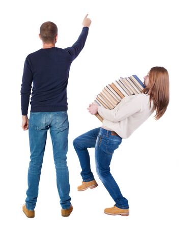 Back view of couple in sweater pointing. Rear view people collection. backside view of person. Isolated over white background.の写真素材