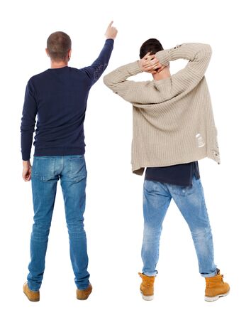 Back view of two man in sweater pointing. Rear view people collection. backside view of person. Isolated over white background.の写真素材