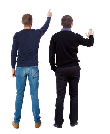 Back view of two man in sweater pointing. Rear view people collection. backside view of person. Isolated over white background.の写真素材