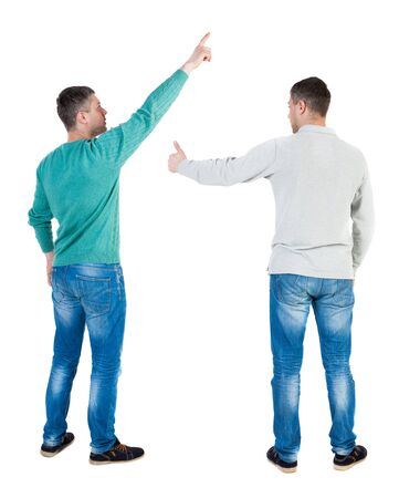 Back view of two man in sweater pointing. Rear view people collection. backside view of person. Isolated over white background.の写真素材