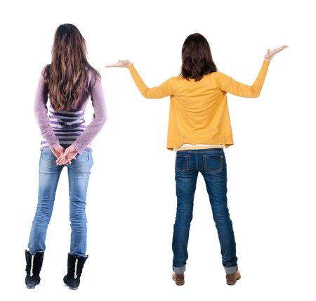 Back view of two woman in sweater. Rear view people collection. backside view of person. Isolated over white background.の写真素材