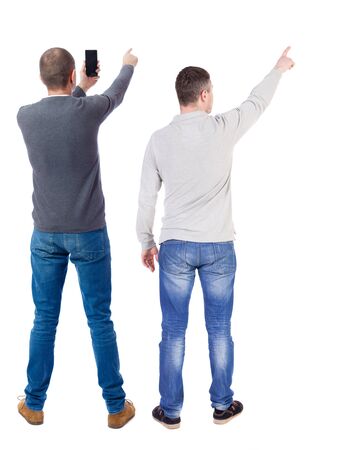 Back view of two man in sweater with mobile phone. Rear view people collection. backside view of person. Isolated over white background.の写真素材