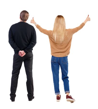Back view of couple in sweater showing thumbs up. beautiful woman and man together. Rear view people collection. backside view of person. Isolated over white background.の写真素材