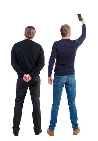 Back view of two man in sweater with mobile phone. Rear view people collection. backside view of person. Isolated over white background.の写真素材