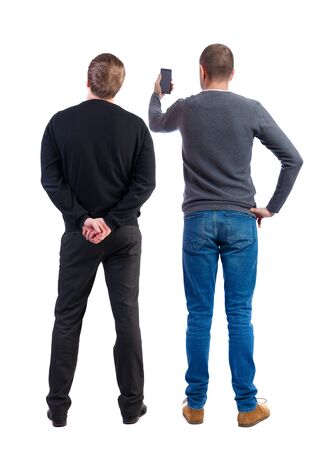 Back view of two man in sweater with mobile phone. Rear view people collection. backside view of person. Isolated over white background.の写真素材
