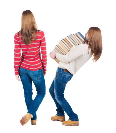 Back view of two woman in sweater. Rear view people collection. backside view of person. Isolated over white background.の写真素材