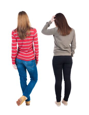 Back view of two woman in sweater. Rear view people collection. backside view of person. Isolated over white background.の写真素材