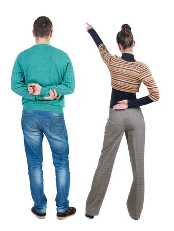 Back view of couple in sweater with mobile phone. beautiful friendly girl and guy together. Rear view people collection. backside view of person. Isolated over white background.の写真素材