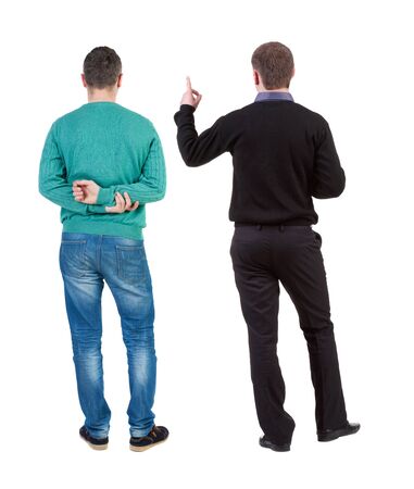 Back view of two man in sweater pointing. Rear view people collection. backside view of person. Isolated over white background.の写真素材