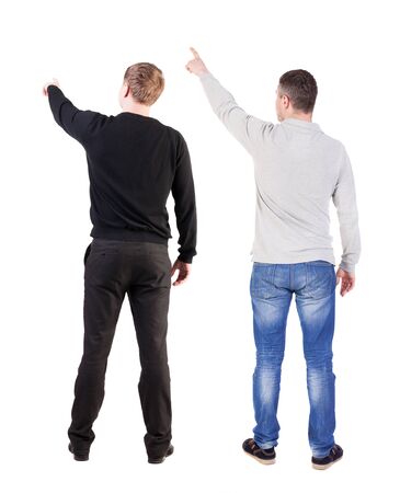 Back view of two man in sweater pointing. Rear view people collection. backside view of person. Isolated over white background.の写真素材
