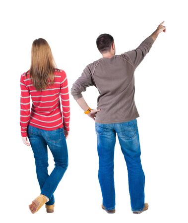 Back view of couple in sweater with mobile phone. beautiful friendly girl and guy together. Rear view people collection. backside view of person. Isolated over white background.の写真素材