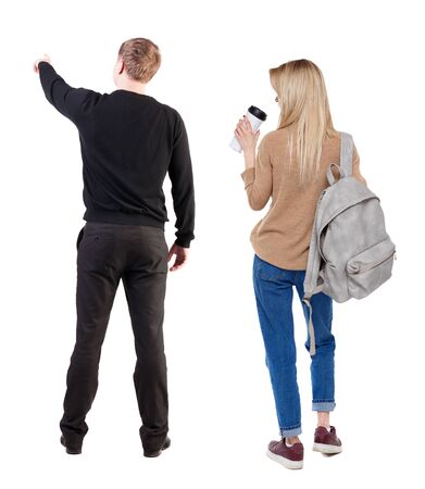 Back view of couple in sweater with mobile phone. beautiful friendly girl and guy together. Rear view people collection. backside view of person. Isolated over white background.の写真素材