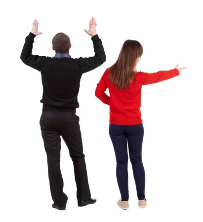 Back view of couple in sweater with mobile phone. beautiful friendly girl and guy together. Rear view people collection. backside view of person. Isolated over white background.の写真素材