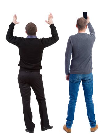 Back view of two man in sweater with mobile phone. Rear view people collection. backside view of person. Isolated over white background.の写真素材