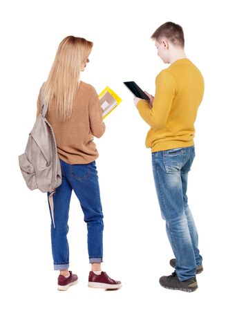 Back view of couple in sweater with mobile phone. beautiful friendly girl and guy together. Rear view people collection. backside view of person. Isolated over white background.の写真素材