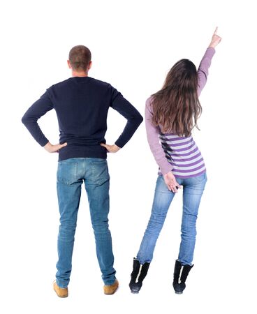 Back view of couple in sweater with mobile phone. beautiful friendly girl and guy together. Rear view people collection. backside view of person. Isolated over white background.の写真素材