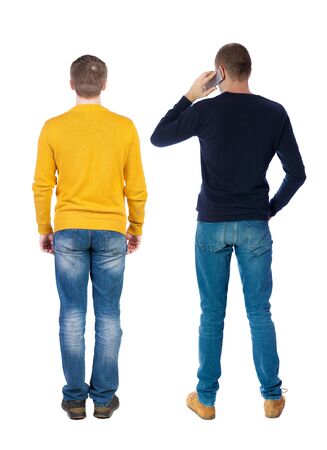 Back view of two man in sweater with mobile phone. Rear view people collection. backside view of person. Isolated over white background.の写真素材