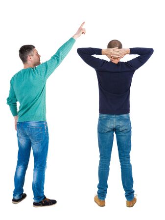 Back view of two man in sweater pointing. Rear view people collection. backside view of person. Isolated over white background.の写真素材