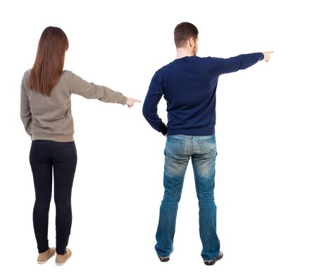 Back view of couple in sweater with mobile phone. beautiful friendly girl and guy together. Rear view people collection. backside view of person. Isolated over white background.の写真素材