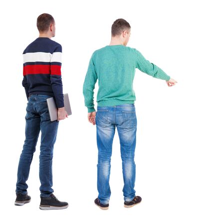 Back view two man in sweater with laptop. Rear view people collection. backside view of person. Isolated over white background. Guys looking forwardの写真素材