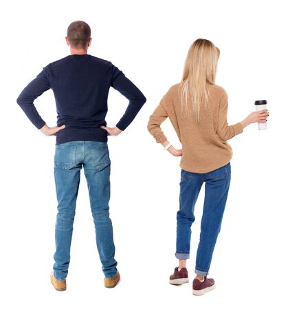 Back view couple with laptop in sweater. beautiful man and woman. Rear view people collection. backside view of person. Isolated over white background.の写真素材