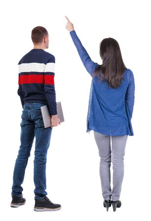 Back view couple with laptop in sweater. beautiful man and woman. Rear view people collection. backside view of person. Isolated over white background.の写真素材