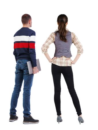 Back view couple with laptop in sweater. beautiful man and woman. Rear view people collection. backside view of person. Isolated over white background.の写真素材