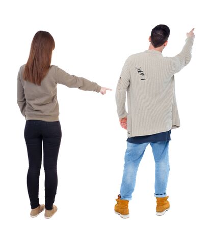 Back view of couple in sweater with mobile phone. beautiful friendly girl and guy together. Rear view people collection. backside view of person. Isolated over white background.の写真素材