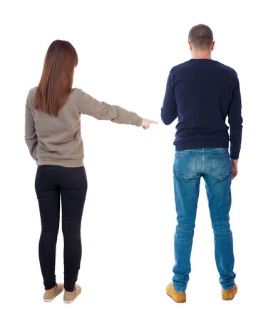 Back view of couple in sweater with mobile phone. beautiful friendly girl and guy together. Rear view people collection. backside view of person. Isolated over white background.の写真素材
