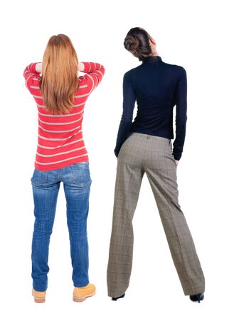 Back view of two woman in sweater. Rear view people collection. backside view of person. Isolated over white background.の写真素材