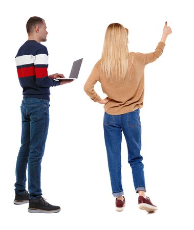 Back view couple with laptop in sweater. beautiful man and woman. Rear view people collection. backside view of person. Isolated over white background.の写真素材