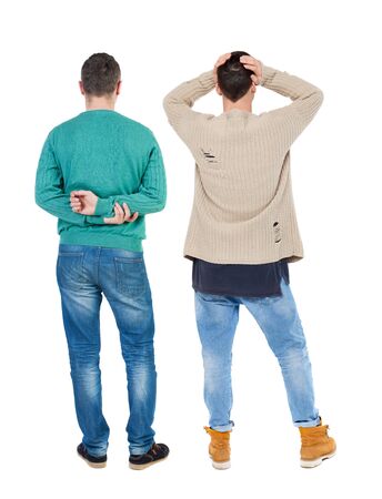 Back view of two man in sweater pointing. Rear view people collection. backside view of person. Isolated over white background.の写真素材